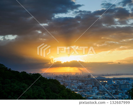 Dawn in the city: A view of the Osaka skyline across Osaka Bay from a hill in Kobe Dawn in the city: A view of the Osaka skyline across Osaka Bay from a hill in Kobe 132687999