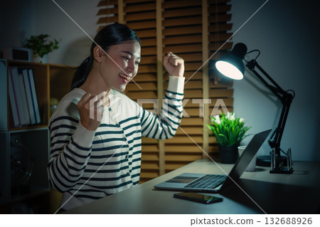 success woman working with laptop at night success woman working with laptop at night 132688926