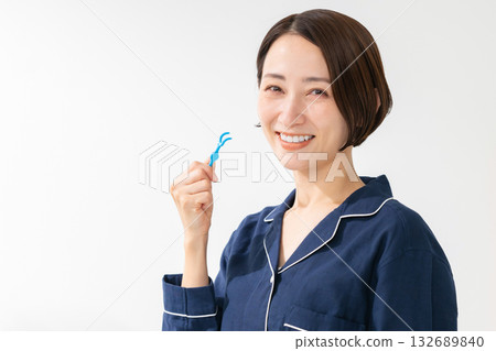 Woman taking care of her teeth Woman taking care of her teeth 132689840