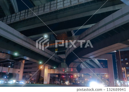 Night view of the junction, with bridge piers and the national highway below 132689941