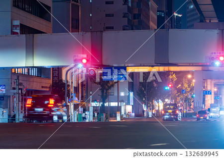 Night view of the junction, with bridge piers and the national highway below 132689945