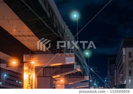 Night view of the junction, with bridge piers and the national highway below Night view of the junction, with bridge piers and the national highway below 132689956