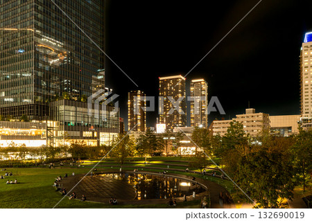 Buildings and parks shining at night Buildings and parks shining at night 132690019