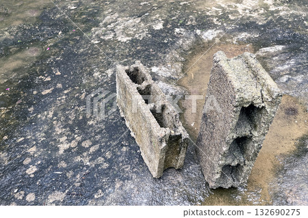 low-quality hollow concrete blocks that crumble when exposed to moisture low-quality hollow concrete blocks that crumble when exposed to moisture 132690275