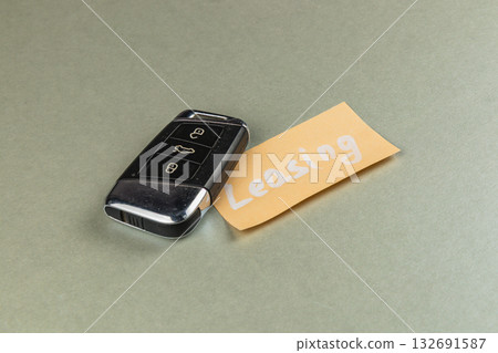 Car key with leasing note on gray background 132691587