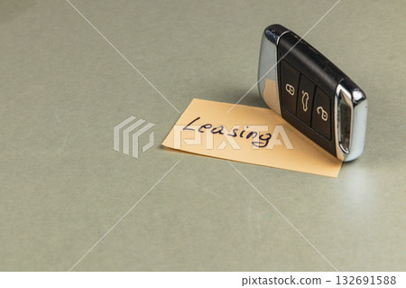 Leasing car key resting on a tag with the word leasing written on it 132691588