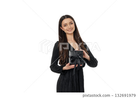 Woman excitedly holds a gift box for Black Friday, isolated, PNG 132691979