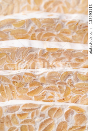 Tempeh texture background, Traditional Indonesian food, Healthy vegan and plant based ingredients Tempeh texture background, Traditional Indonesian food, Healthy vegan and plant based ingredients 132693118