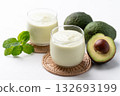 Avocado smoothie with milk in glass and avocado fruit on white background, Healthy drink 132693199