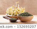 Mung bean seeds and sprouts on wooden background, Food ingredient in Asian cuisine 132693207