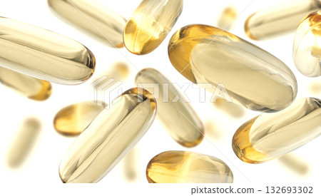 Yellow capsules levitate on a white background 132693302
