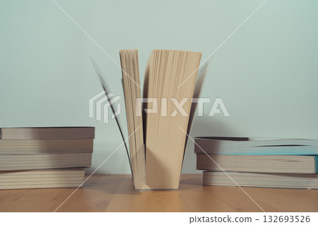 stack of book on table with soft focus library or bookstore background stack of book on table with soft focus library or bookstore background 132693526