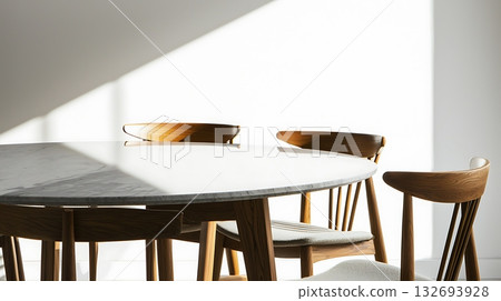 A wooden table with four chairs around it A wooden table with four chairs around it 132693928