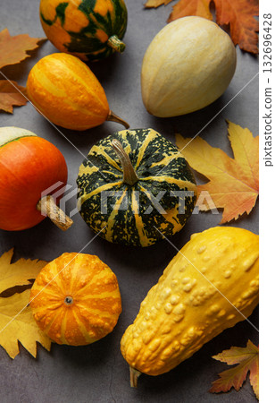 Autumn gourds and leaves creating a seasonal still life Autumn gourds and leaves creating a seasonal still life 132696428