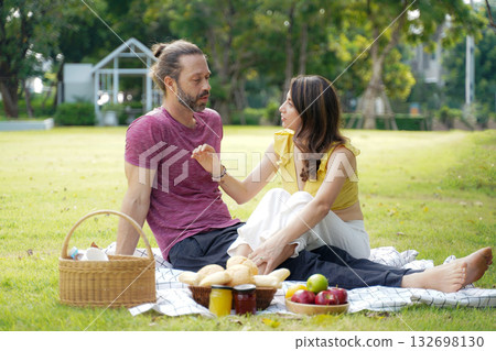 Happy family picnic in the park public on summer holiday. Family relax and enjoying outdoor. Happy family picnic in the park public on summer holiday. Family relax and enjoying outdoor. 132698130