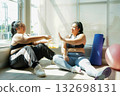 Healthy fat women and friend eating snack after exercise.   132698131
