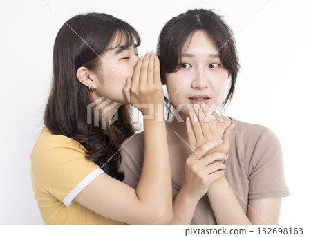 Portrait of two beautiful gossiping girls Portrait of two beautiful gossiping girls 132698163