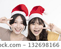 Girls in Santa's caps having fun 132698166