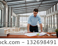 Young businessman, engineer working in office, working on plan or technical document. 132698491