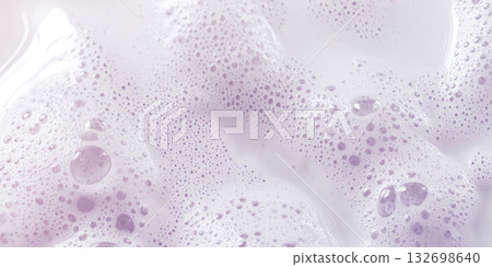 Frothy foam texture pattern with sparkling bokeh lights and soft hues in background 132698640