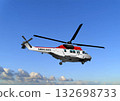 Red and white ambulance helicopter flying providing emergency medical services 132698733