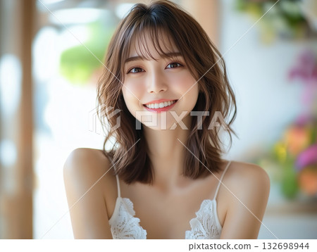 Indoor fashion portrait of a young woman with a cute smile 132698944