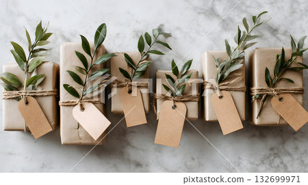 Beautifully wrapped gifts with natural elements arranged on a marble surface during daylight 132699971