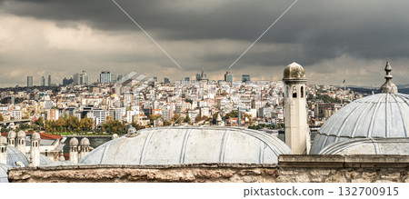Istanbul skyline panorama with Galata Tower from Suleymaniye Mosque, view over domes under stormy sky. Travel concept 132700915