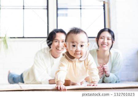 Young couple watching over their baby 132701023