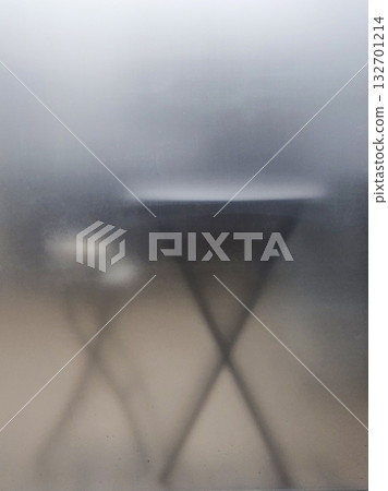 The cafe's windows are fogged up. The cafe's windows are fogged up. 132701214