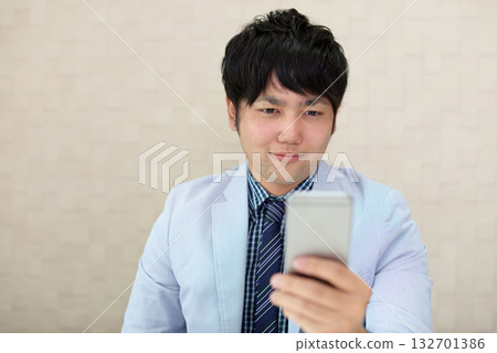Men with smartphones Men with smartphones 132701386