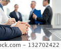Close up hands of businessman during corporate meeting, collaboration and teamwork. 132702422