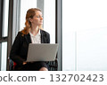 Happy caucasian businesswoman working on laptop in comfortable modern office. 132702423