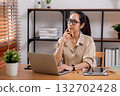 Young asian business woman working with laptop while thinking for planning financial on desk. 132702428