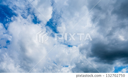Many white clouds flowing in the summer blue sky Many white clouds flowing in the summer blue sky 132702750