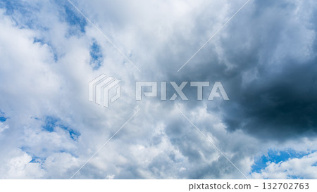 Many white clouds flowing in the summer blue sky Many white clouds flowing in the summer blue sky 132702763