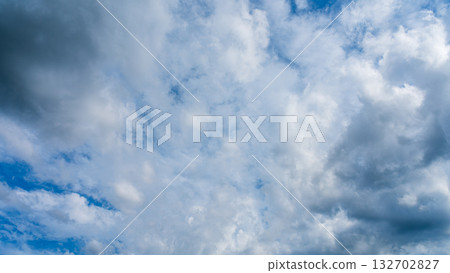 Many white clouds flowing in the summer blue sky Many white clouds flowing in the summer blue sky 132702827