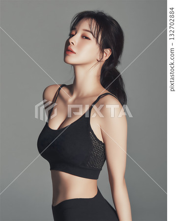 Portrait of a woman in black sportswear 132702884