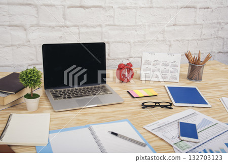 Meeting room Office laptop business financial document chart , graph on wooden table with coffee cup. Flat lay notebook computer laptop on office desk. No people business graph chart on meeting table Meeting room Office laptop business financial document chart , graph on wooden table with coffee cup. Flat lay notebook computer laptop on office desk. No people business graph chart on meeting table 132703123