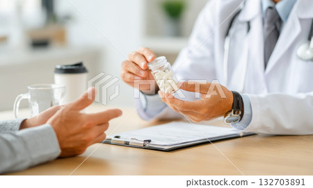 Explaining medication prescription to a patient during a consultation in a medical office 132703891
