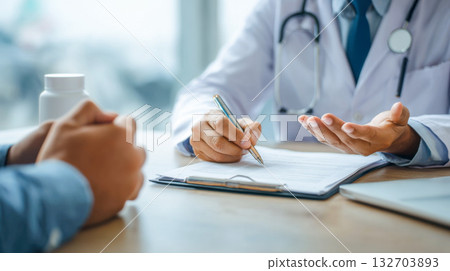 Consultation session in a healthcare setting focusing on patient interaction and discussion 132703893