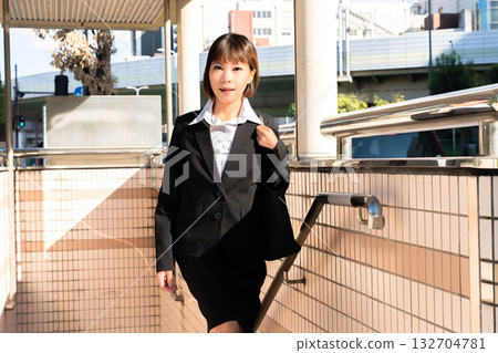 Woman leaving the subway station 132704781