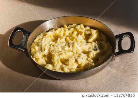 Closed up mashed potato with in serving bowl. 132704830