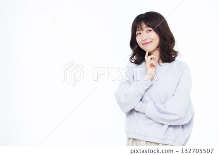 Woman thinking with a smile 132705507