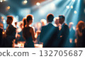 People enjoying a gala event in formal attire with elegant lighting and a lively atmosphere 132705687