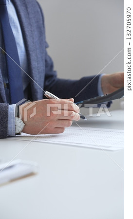 Financial professional analyzing company reports with magnifying glass, checking detailed metrics and verifying accounting precision on desk workspace. Audit and taxes in business Financial professional analyzing company reports with magnifying glass, checking detailed metrics and verifying accounting precision on desk workspace. Audit and taxes in business 132705970