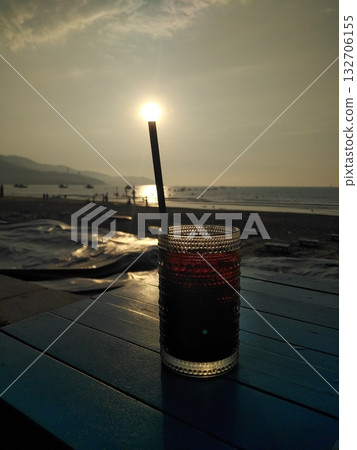 The sun came to drink coffee on a morning by the sea The sun came to drink coffee on a morning by the sea 132706155