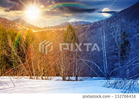 mountain landscape with mixed forest on snow covered slope. day and night time change concept. sky with clouds, sun and moon on spring equinox. duality and transition template. naked trees scenery mountain landscape with mixed forest on snow covered slope. day and night time change concept. sky with clouds, sun and moon on spring equinox. duality and transition template. naked trees scenery 132706438