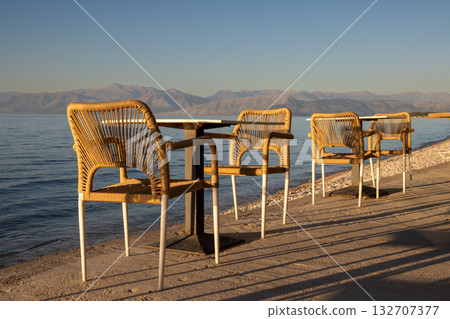 Empty restaurant terrace with seaview, Greece Empty restaurant terrace with seaview, Greece 132707377