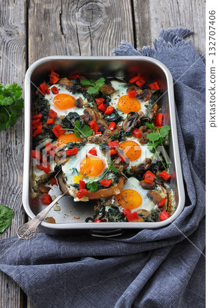 baked eggs with spinach, mushroom, sweet pepper 132707406